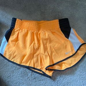 Nike dri fit shorts size small. Neon orange